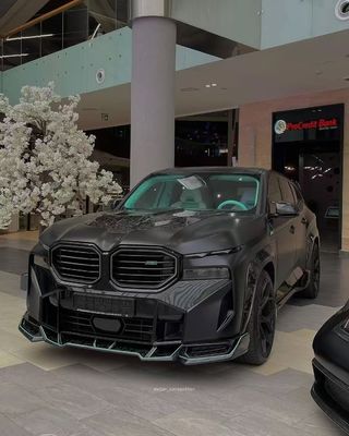 XM Bmw Wide Body Kit Fibra di carbonio Spoiler della bocca anteriore Nero Bmw Side Skirt Arco della ruota